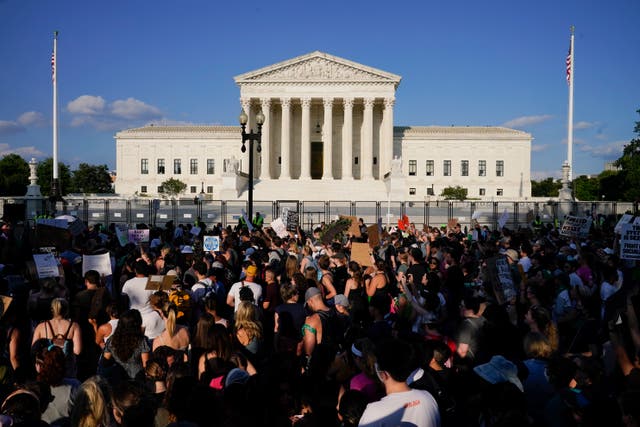 <p>Protesters fill the street in front of the Supreme Court after the decision to overturn Roe v Wade</p>