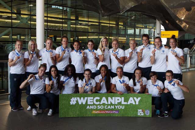 The Lionesses pose with their third place winners’ medals after returning from the 2015 World Cup (Steve Parsons/PA)