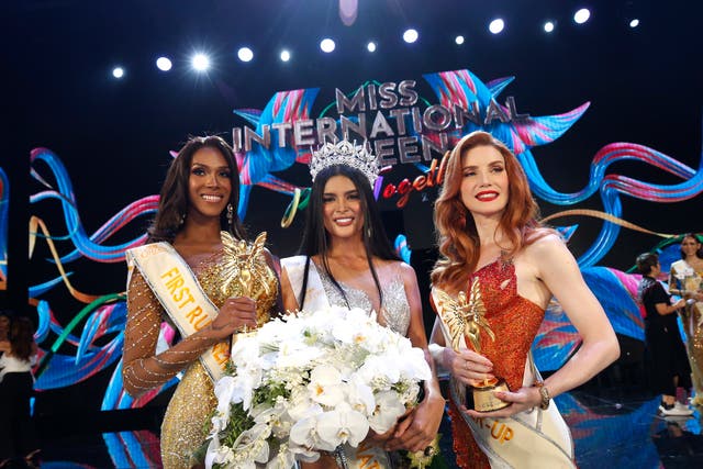 <p>Fuschia Anne Ravena, the Miss International Queen 2022, is flanked by first runner-up ‘Miss Colombia’ Jasmine Jimenez and second runner-up ‘Miss France’ Aela Chanel </p>