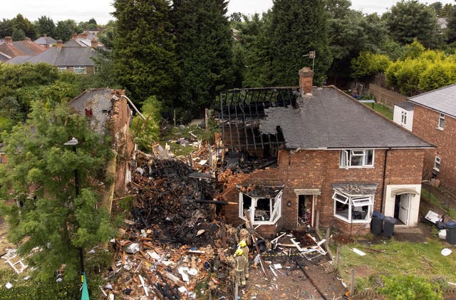 Emergency services at the scene in Dulwich Road, Kingstanding, in Birmingham, where a woman has been found dead after a house was destroyed in a gas explosion. One man rescued from the wreckage remains in hospital in a life-threatening condition. Picture date: Monday June 27, 2022.