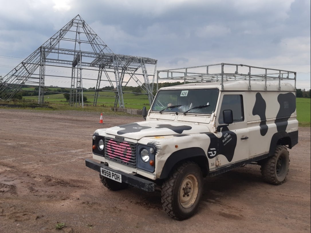 An old Land Rover Defender which is now a fully electric vehicle, at the Worthy Farm Glastonbury Festival site