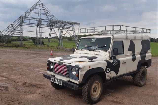 <p>An old Land Rover Defender which is now a fully electric vehicle, at the Worthy Farm Glastonbury Festival site</p>