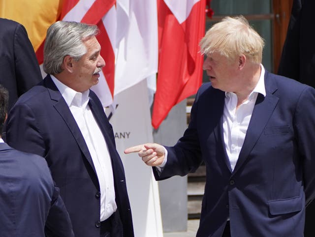 <p>Boris Johnson talks with Argentina’s president Alberto Fernandez</p>
