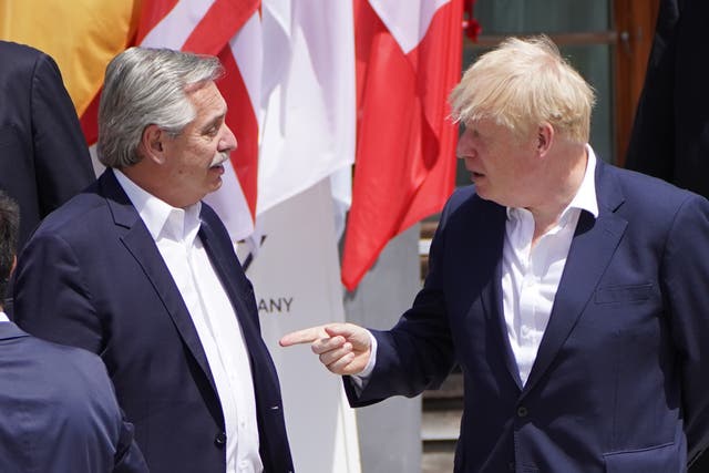 <p>Boris Johnson talks with Argentina’s president Alberto Fernandez</p>