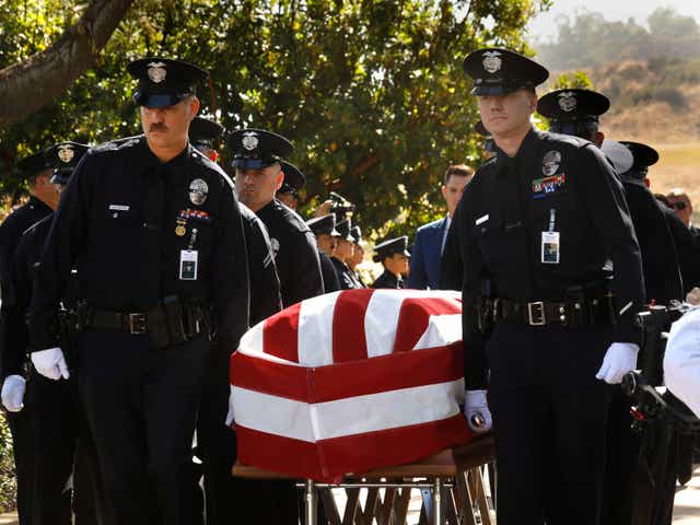 <p>Los Angeles Police Department officers carry the casket of LAPD Officer Houston R. Tipping at the beginning of his memorial service on Wednesday, June 22, 2022, at Forest Lawn Hollywood Hills in Los Angeles</p>