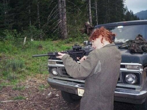 One of Ní Fhlannagáin’ patients, who has since died, practising with a rifle near the clinic