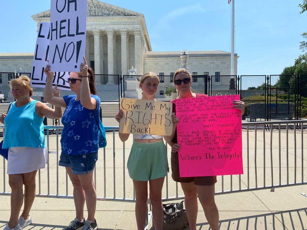 Madeline, 14, and her mother Kristen, 46, outside the Supreme Court