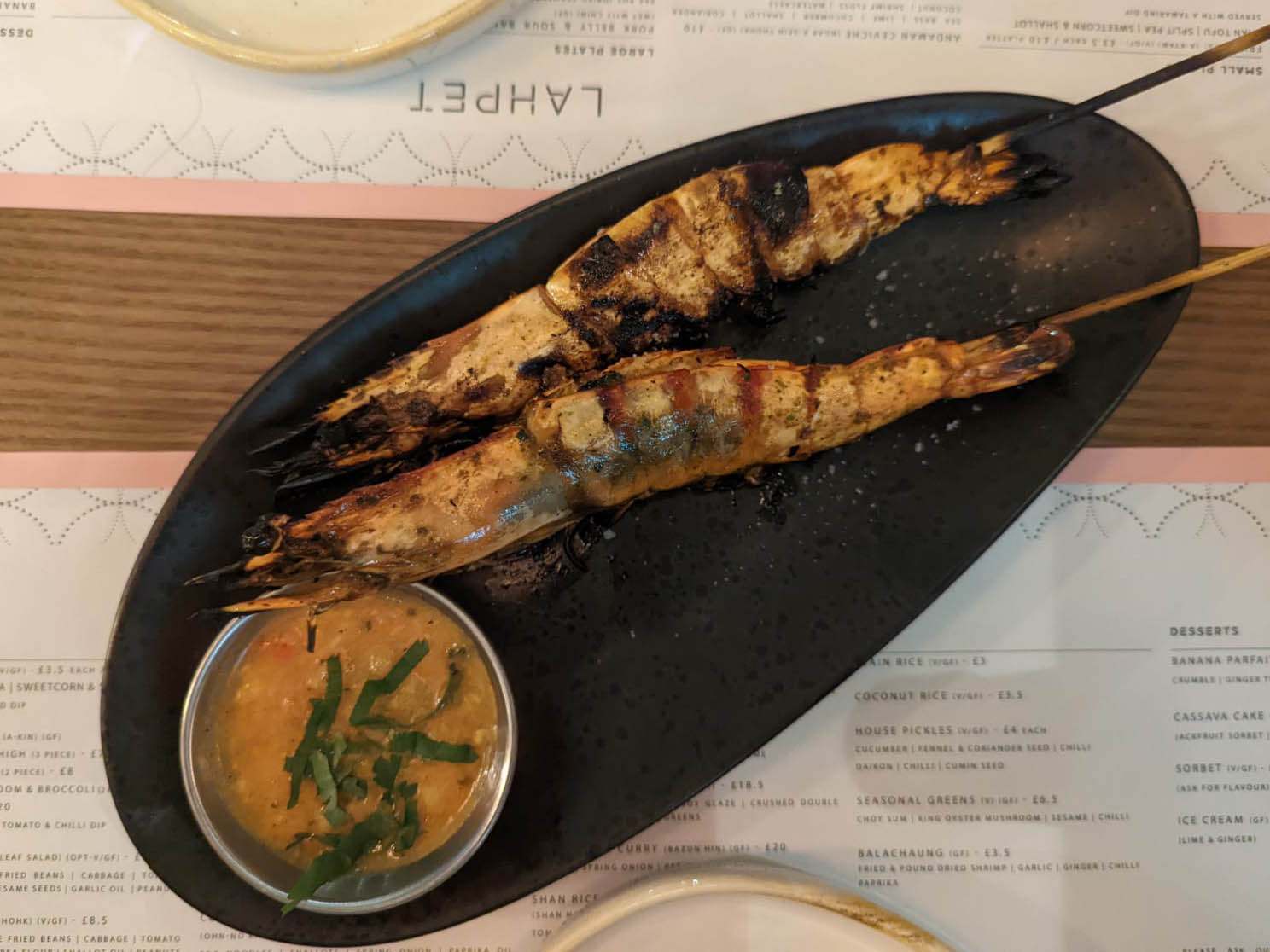 The chargrilled black tiger prawns have taken on a sultry sweet smokiness