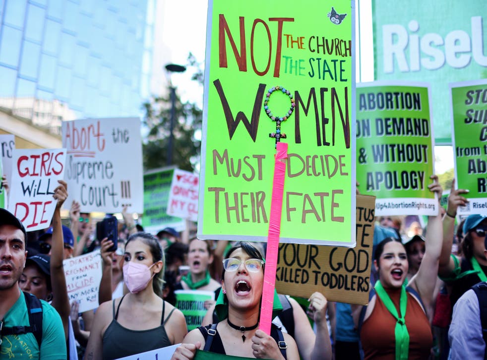 <p>Abortion rights supporters march in Los Angeles on 27 June 2022</p>