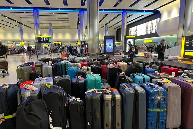 <p>Suitcases at Heathrow terminal 2 yesterday</p>