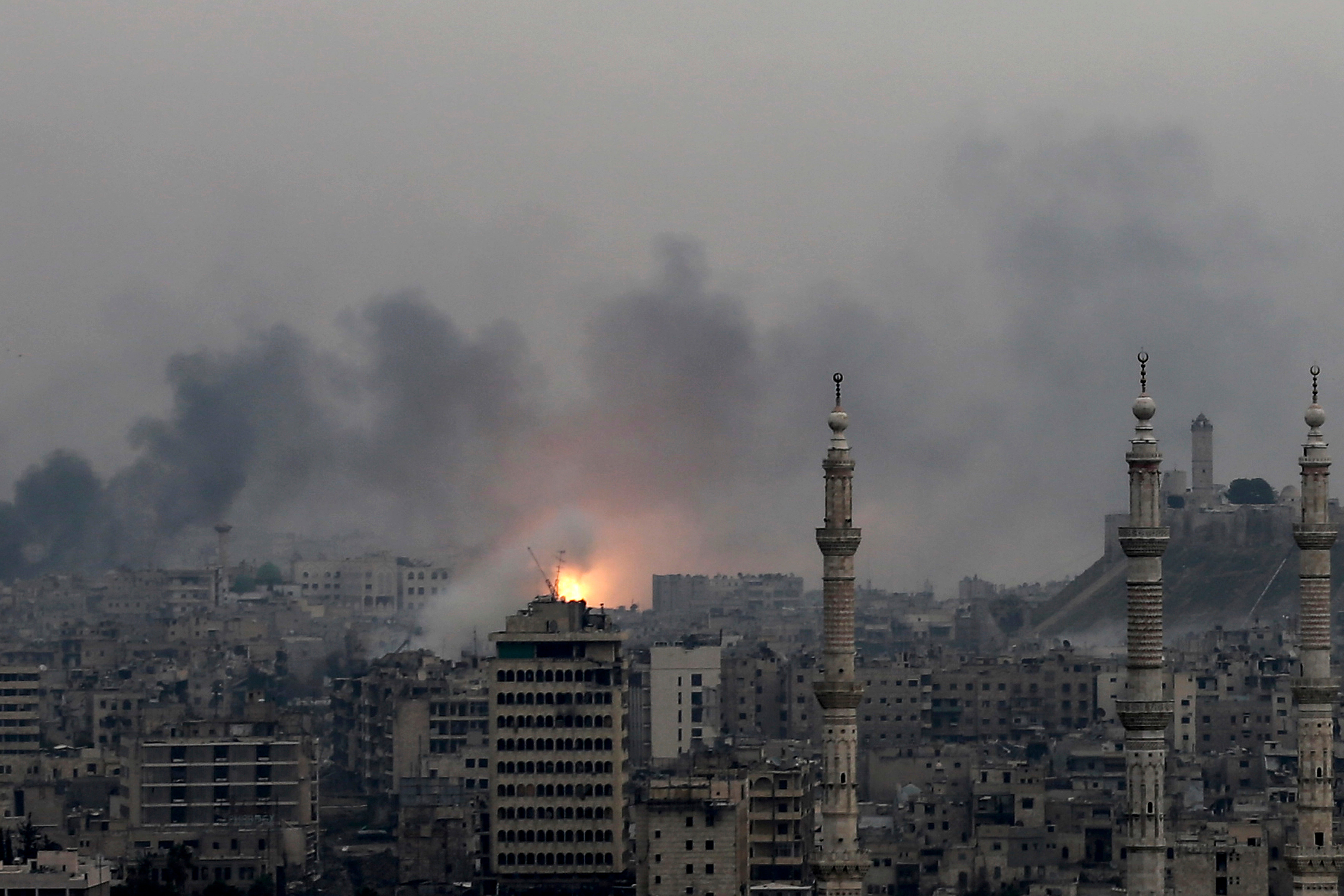 A ball of fire rises following a Syrian government air strike that hit rebel positions in the eastern neighborhoods of Aleppo, Syria, Dec. 5, 2016.