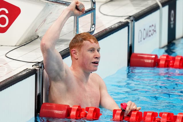 Tom Dean celebrates his victory in the Olympic 200m freestyle final in Tokyo (Joe Giddens/PA)