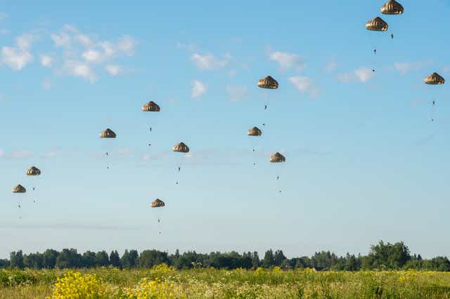 <p>Paratroopers taking part in a military exercise over Estonia</p>