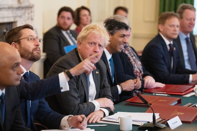 Prime Minister Boris Johnson looks on as Cabinet Secretary, Simon Case, gestures at a Cabinet meeting at 10 Downing Street, London. Mr Case appeared before a parliamentary committee on Tuesday (Carl Court/PA)
