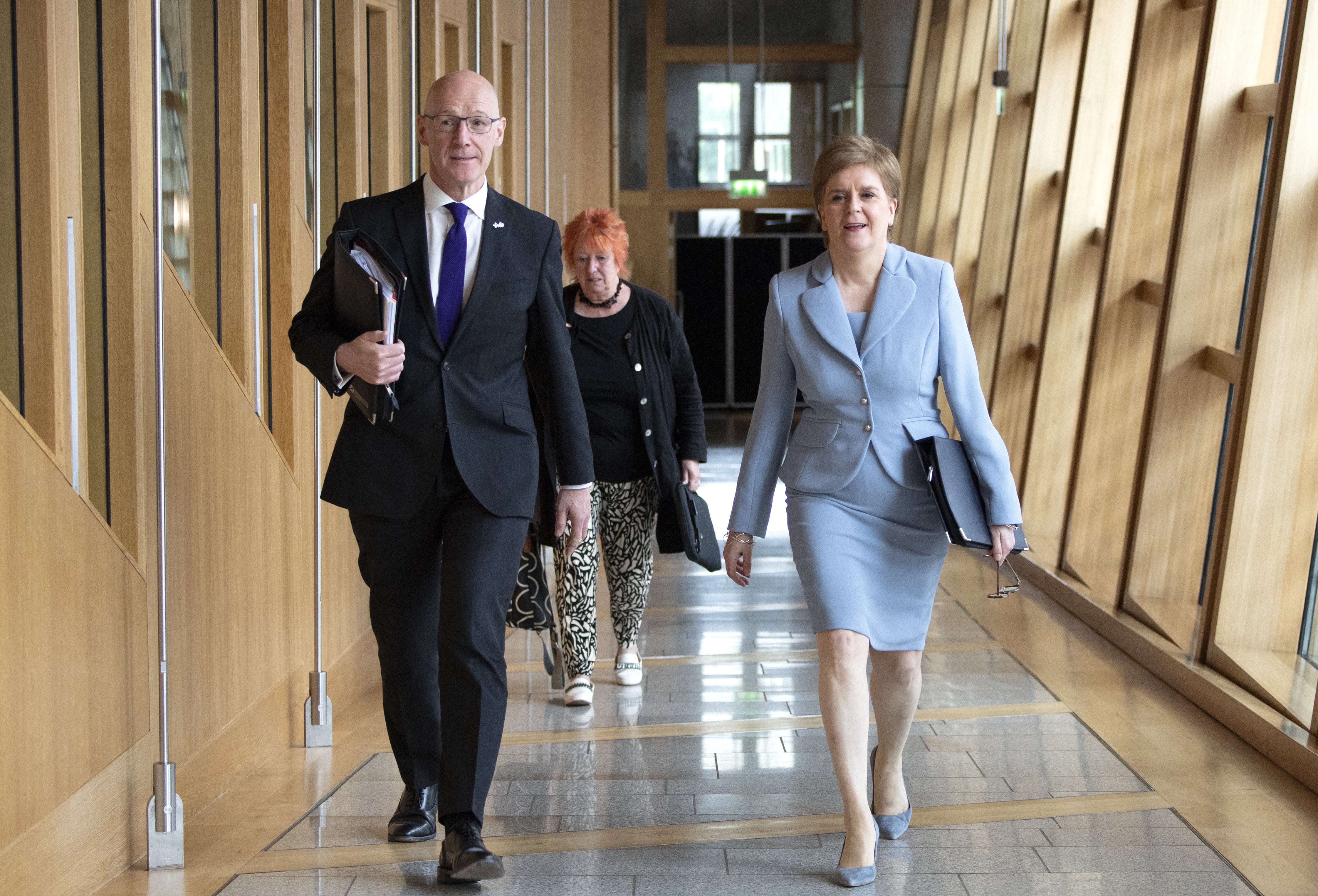 First Minister Nicola Sturgeon (right) on her way to the Chamber to deliver a statement to MSPs in the Scottish Parliament, Edinburgh, on her plans to hold a second referendum on Scottish independence on October 19, 2023. (Lesley Martin/PA)