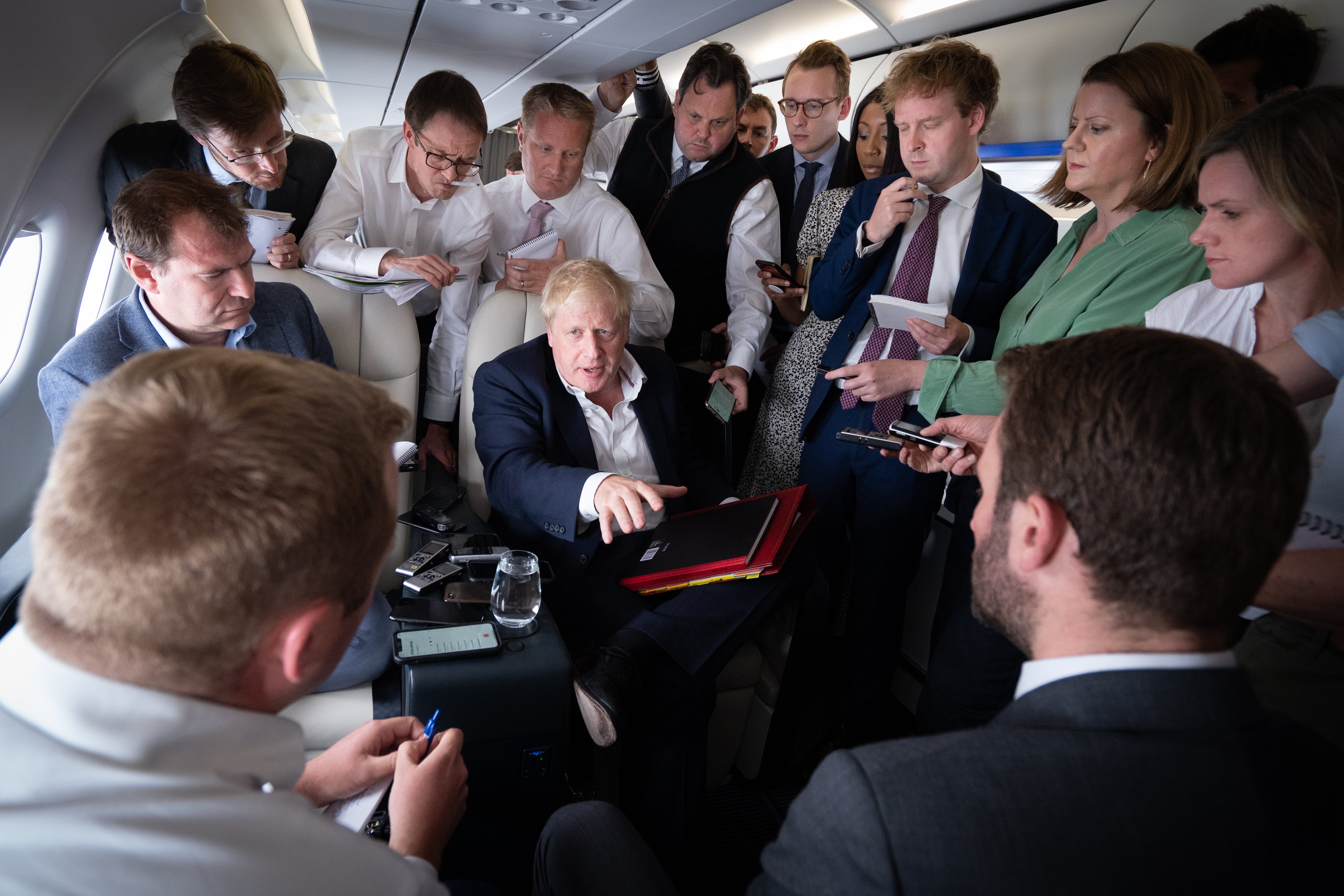 Prime Minister Boris Johnson talks to journalists on his plane during a flight from Germany where he was attending the G7 Summit to the Nato summit (Stefan Rousseau/PA)