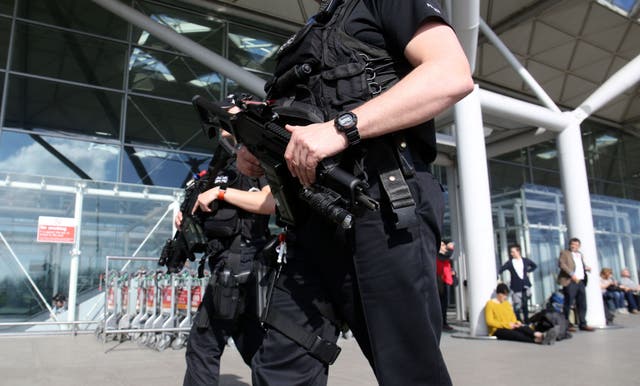 <p>File: Armed police officers at Stansted Airport in 2018 </p>