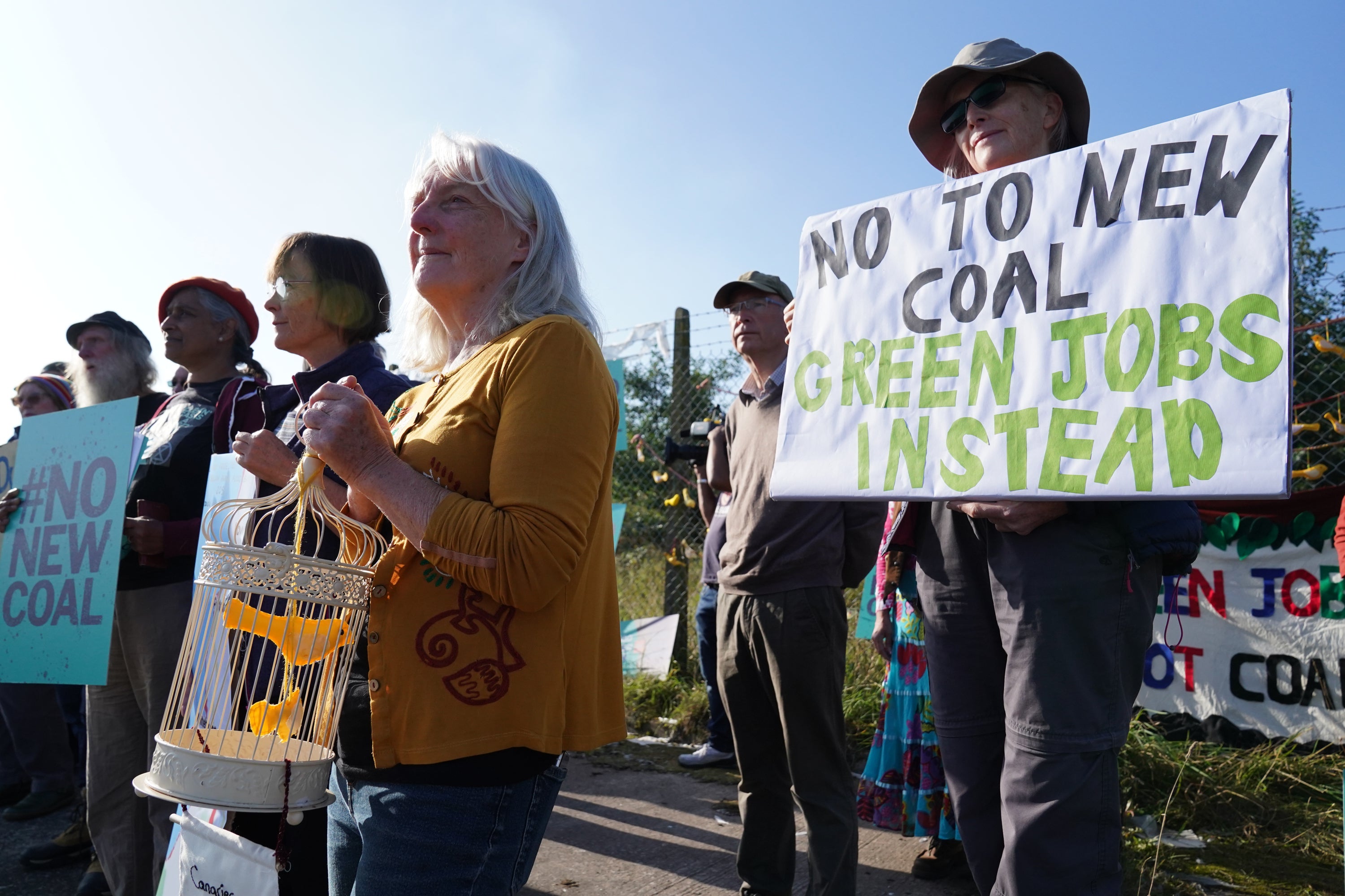 Demonstrators outside the proposed Woodhouse Colliery, south of Whitehaven, ahead of a public inquiry into the plans for a new deep coal mine on the Cumbrian coast (Owen Humphreys/PA)
