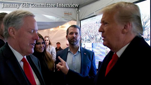 <p>Mark Meadows talking to Donald Trump as Donald Trump Jr. stands by </p>