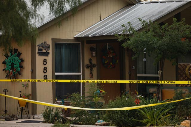 <p>The home of gunman Salvador Ramos is cordoned off with police tape</p>