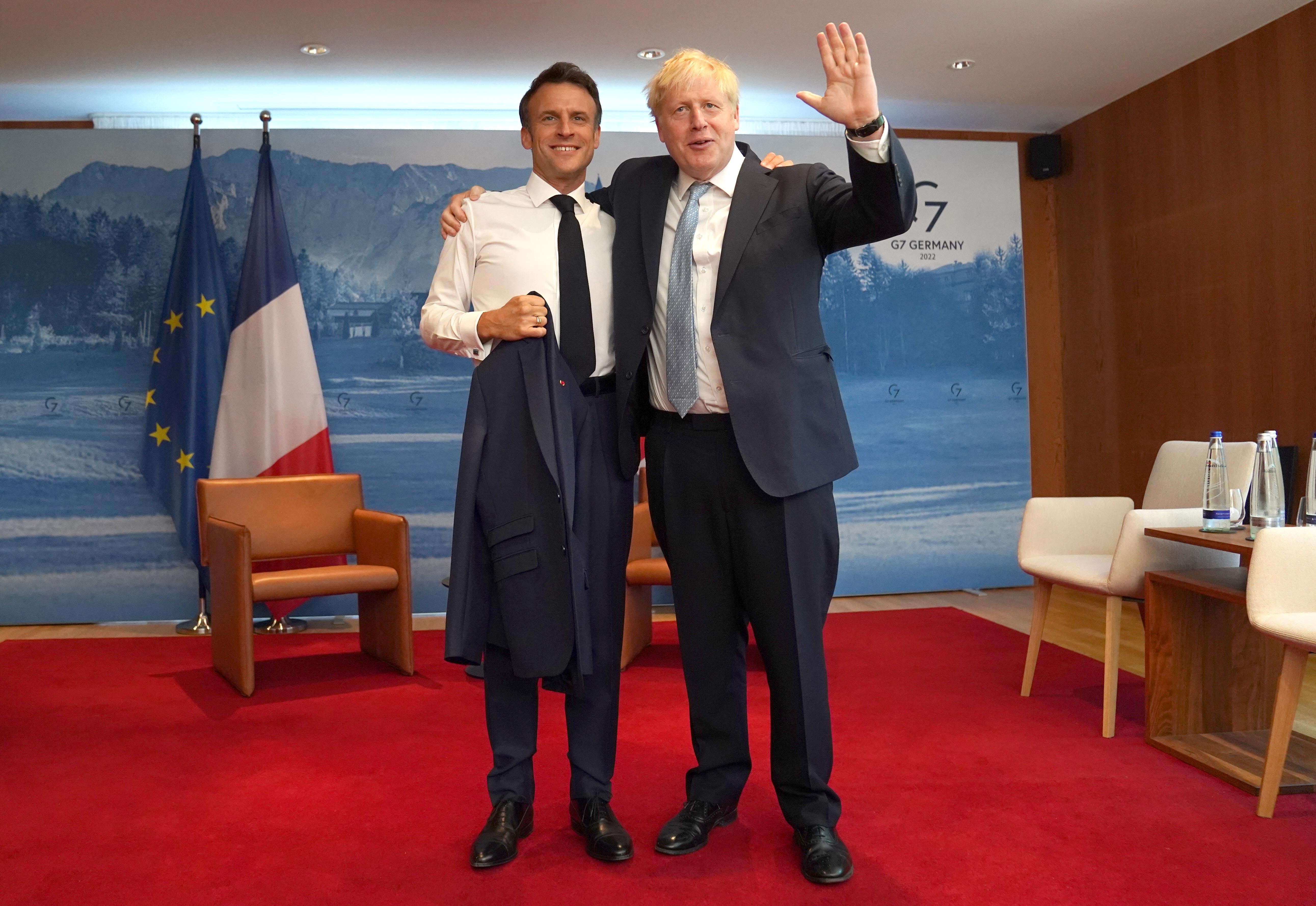 Prime Minister Boris Johnson greets French President Emmanuel Macron (PA)
