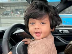 Baby’s stunning mop of black hair definitely not a wig, mother says