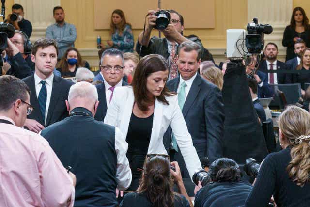 Cassidy Hutchinson, an aide to then White House chief of staff Mark Meadows, stands up at the start of a break during a House Select Committee hearing to Investigate the January 6th Attack on the US Capitol, in the Cannon House Office Building on Capitol Hill in Washington, DC on June 28, 2022