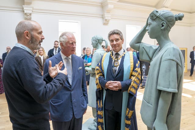 The Prince of Wales, centre, with sculptor Kenny Hunter, left, and Professor Michael Griffin (Jane Barlow/PA)