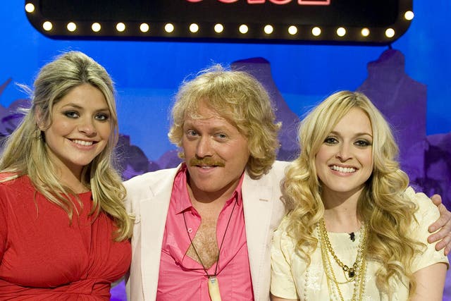 <p>Leigh Francis as Keith Lemon (centre), alongside past ‘Celebrity Juice’ team captains Holly Willoughby (left) and Fearne Cotton (right)</p>