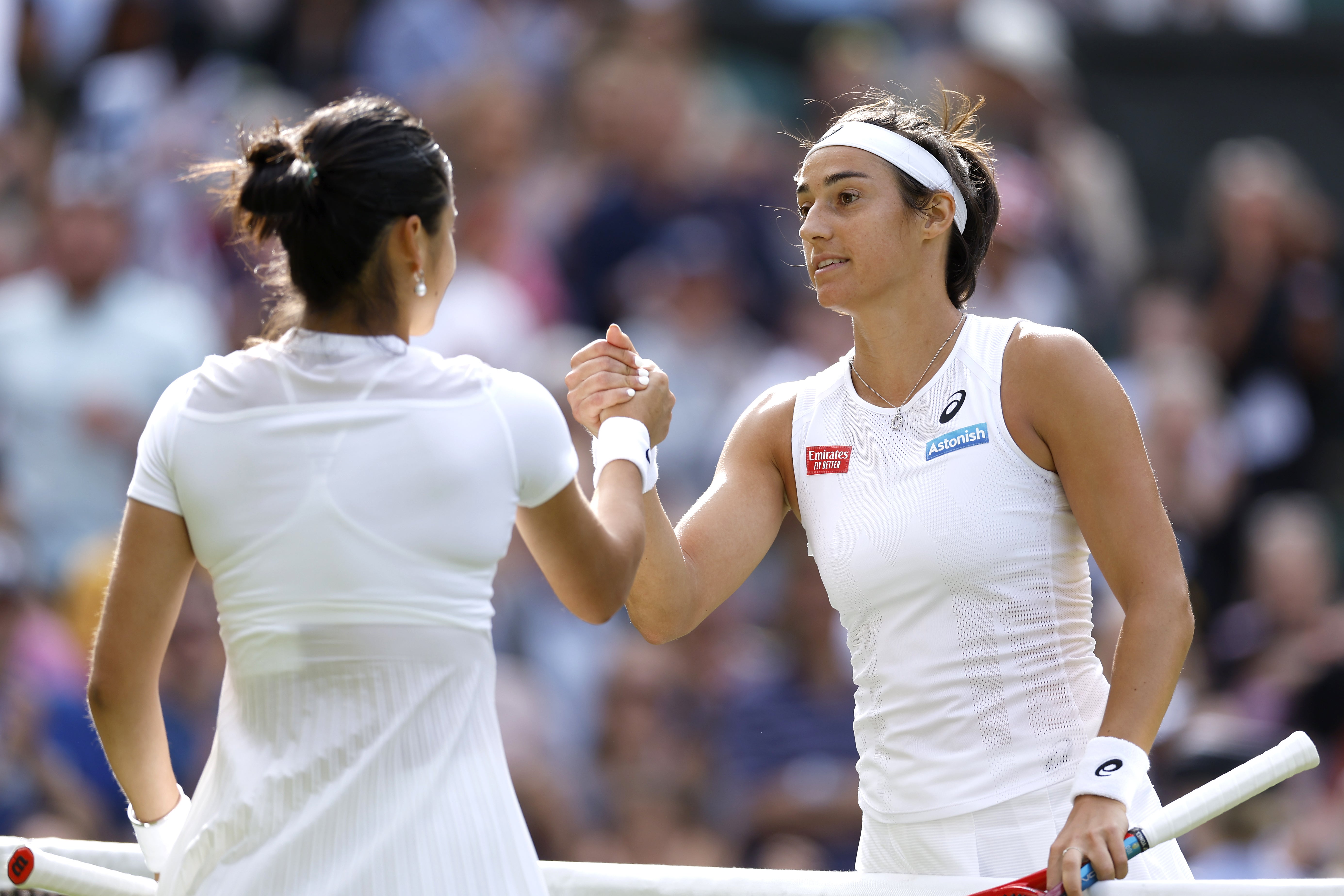 France’s Caroline Garcia (right) shakes hands with Great Britain’s Emma Raducanu after victory in the second round match on Centre Court (Steven Paston/PA)