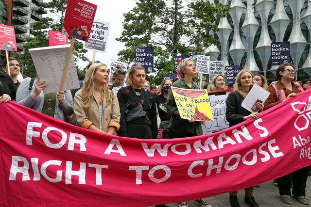 <p>Demonstrators gather outside the United States embassy in Vauxhall, south London to protest against the decision to end constitutional protections for abortion in the US </p>