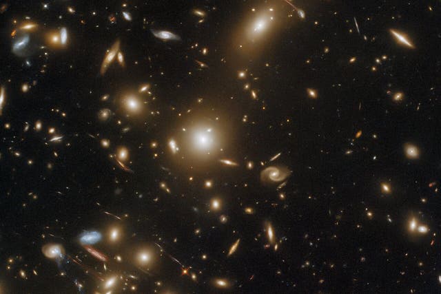 <p>An image of the distant galaxy cluster Abell 1351 taken by the Hubble Space Telescope</p>