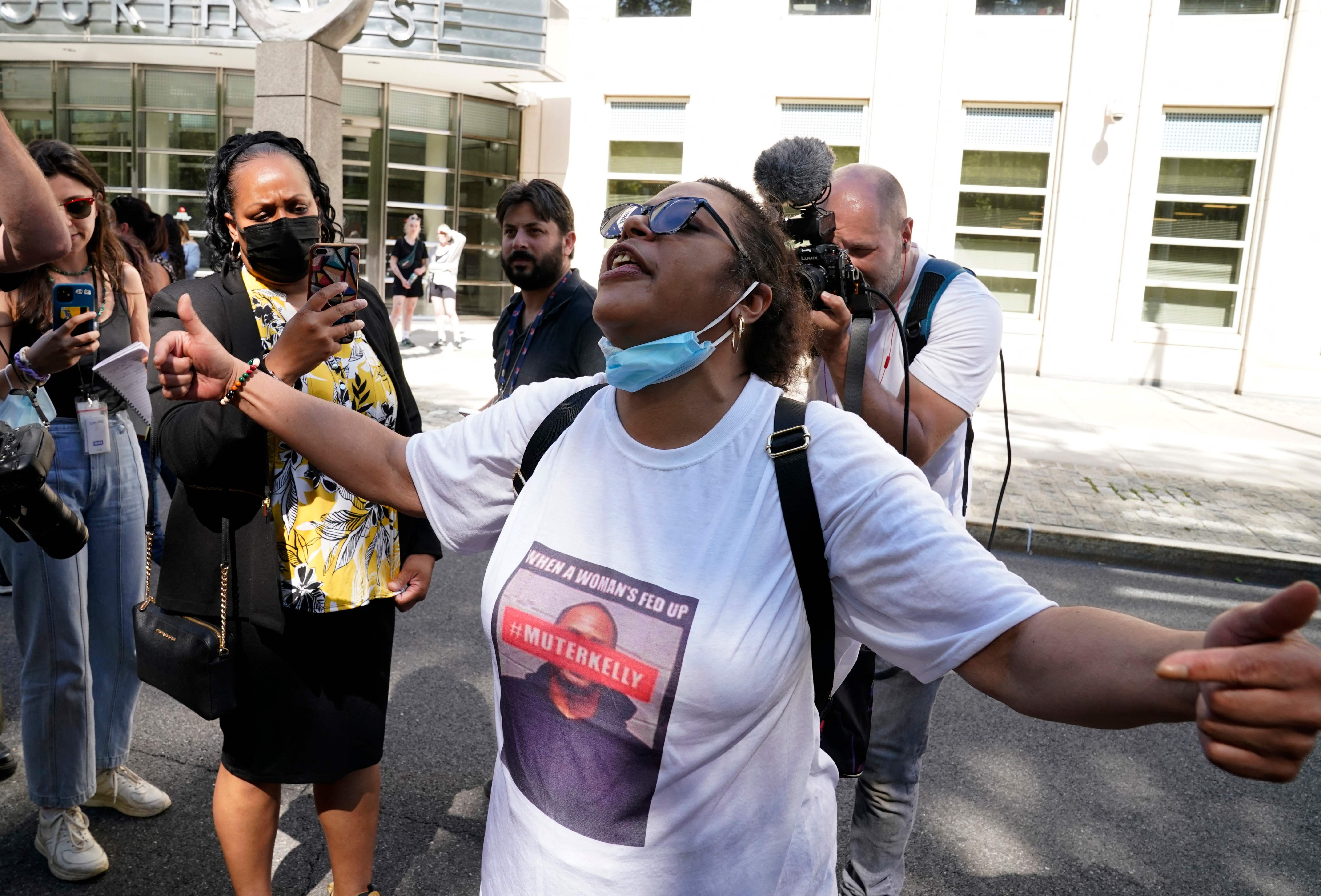 R&B singer R. Kelly's supporter reacts following the sentencing hearing at Brooklyn Federal Court in New York, on June 29, 2022.