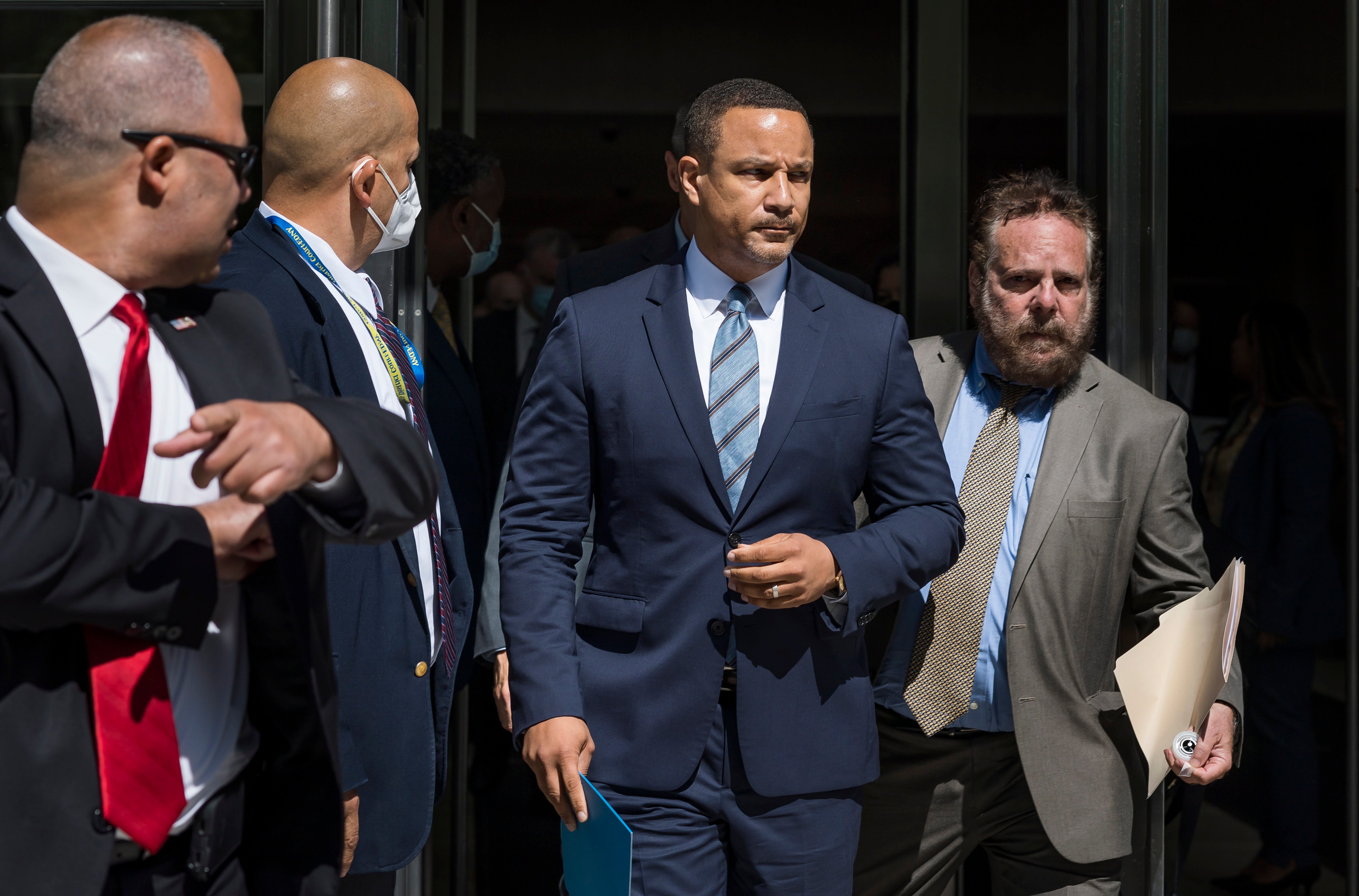 Breon Peace (C), the United States Attorney for the Eastern District of New York, walks to a press conference outside of the United States Courthouse after former R&B singer R. Kelly was sentenced to 30 years in prison after his conviction last year on federal racketeering and sex trafficking charges in the Brooklyn borough of New York, New York, USA, 29 June 2022.