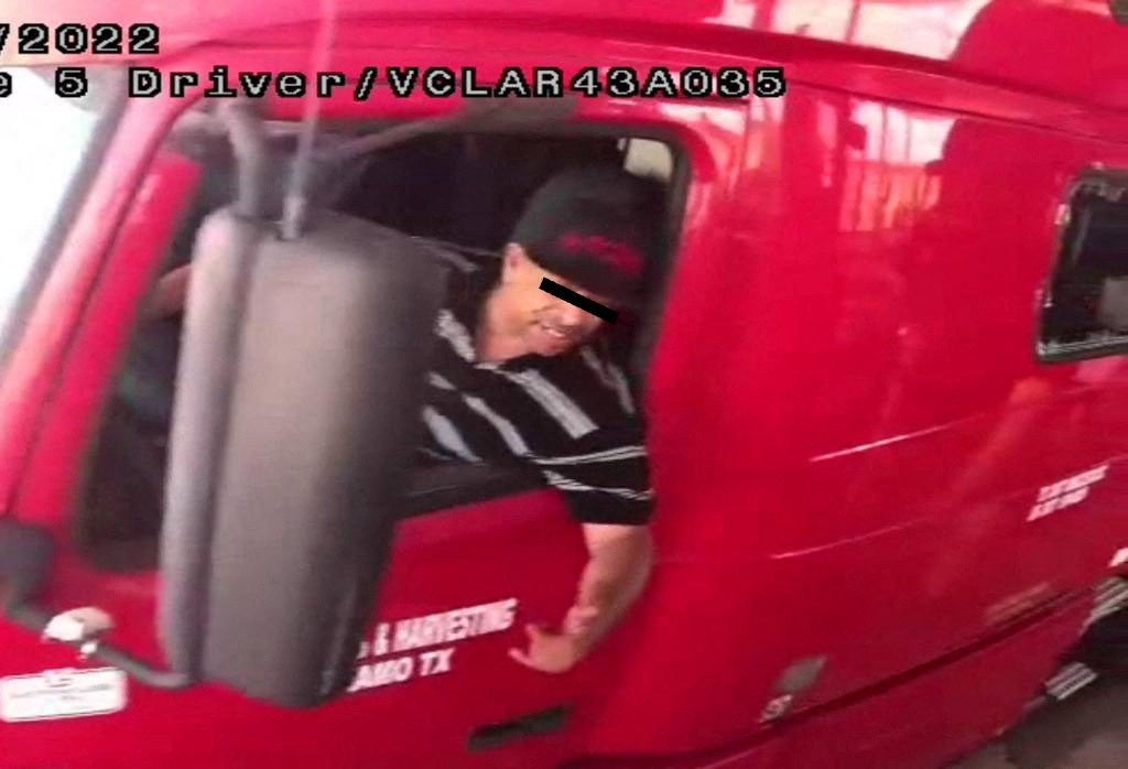 The alleged driver of a truck carrying dozens of migrants, identified by Mexican immigration officials as ‘Homero N’, drives through a security checkpoint in this surveillance photograph in Laredo, Texas, in this handout photo distributed to Reuters on June 29, 2022