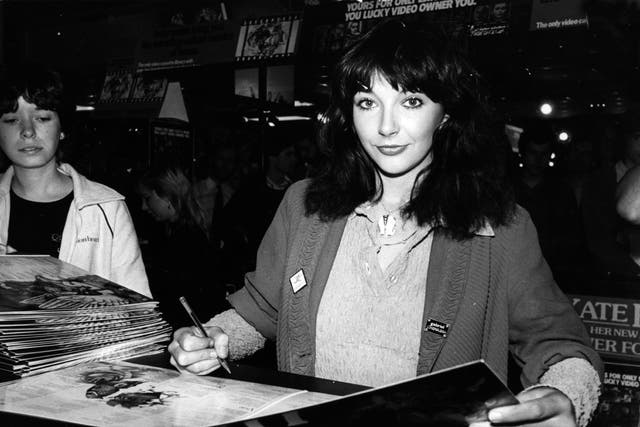 <p>Bush signs copies of her album ‘Never For Ever’ at Virgin Megastore, London, in 1980 </p>