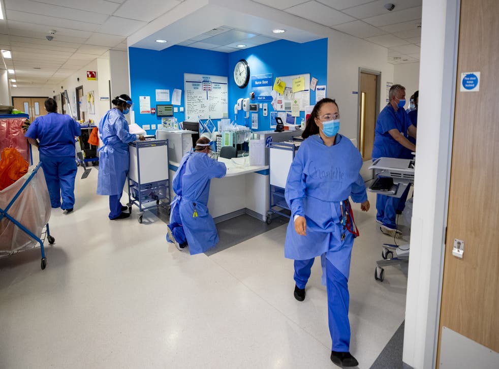 File photo of staff on a hospital ward (Peter Byrne/PA)