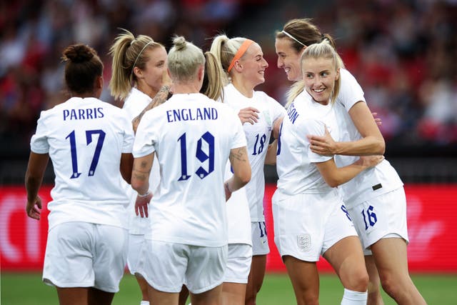 <p>England celebrate their fourth goal, from Jill Scott </p>