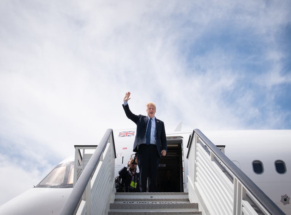 Boris Johnson boarding a plane as he leaves the Nato summit in Madrid (Stefan Rousseau/PA)