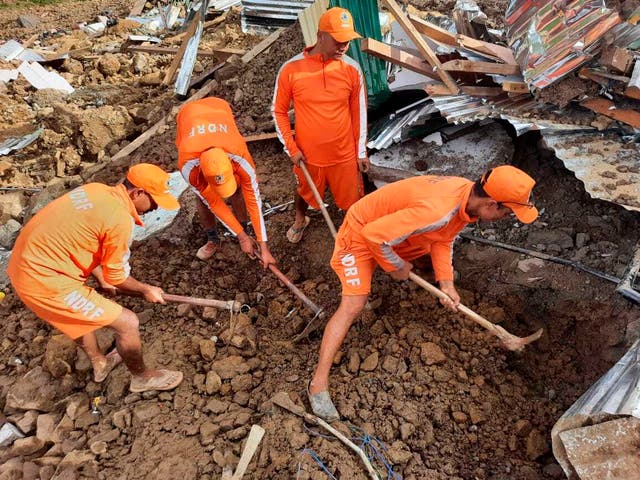 <p>Rescuers trying to find those buried under the debris after a mudslide in Noney, northeastern Manipur state, India</p>