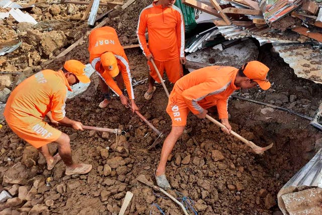 <p>Rescuers trying to find those buried under the debris after a mudslide in Noney, northeastern Manipur state, India</p>