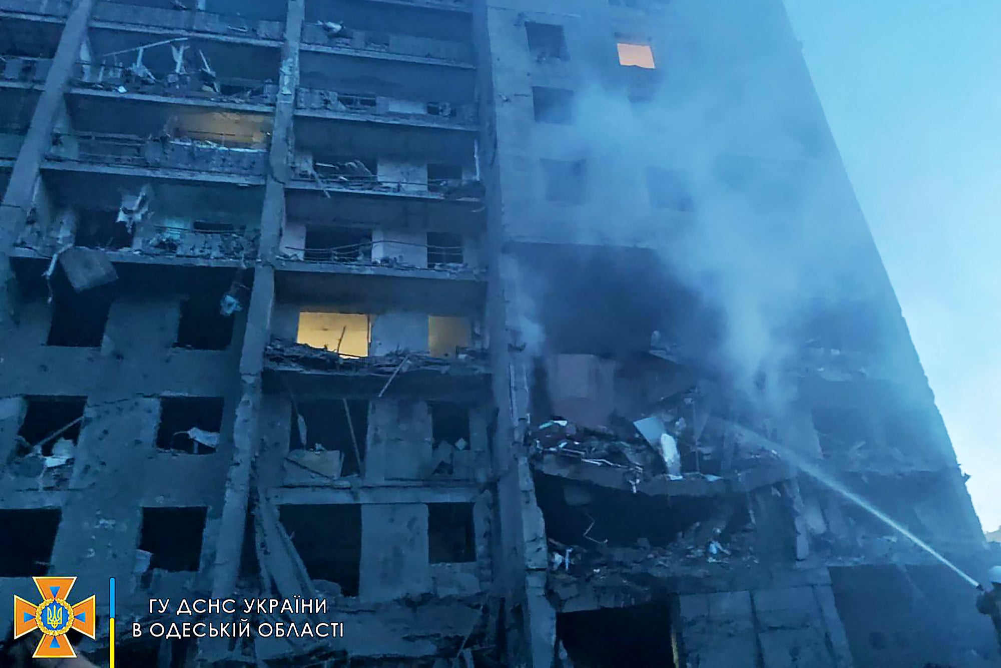A firefighter putting out the fire in a residents building hit by a missile strike in the Ukrainian district of Bilhorod-Dnistrovskyi outside Odesa