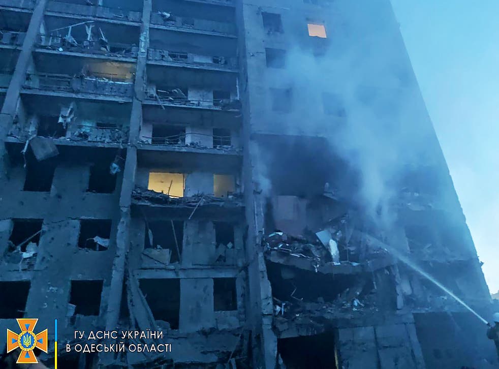 <p>A firefighter putting out the fire in a residents building hit by a missile strike in the Ukrainian district of Bilhorod-Dnistrovskyi outside Odesa</p>