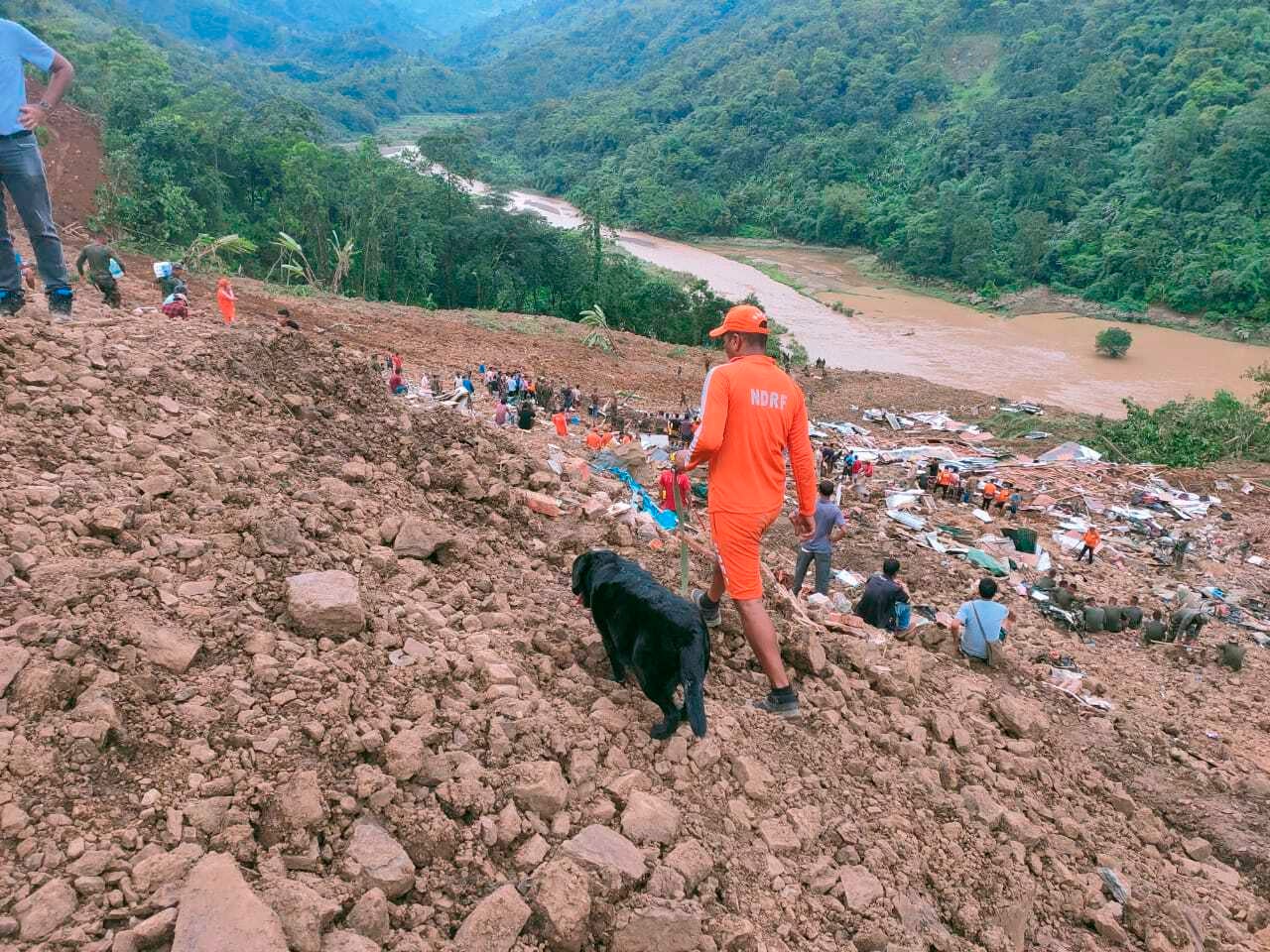 NDRF personnel and others trying to rescue those buried under the debris