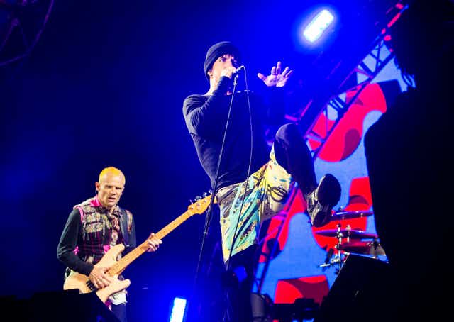 Red Hot Chili Peppers lead singer Anthony Kiedis (right) with bassist Flea (left) as they perform during the Leeds Festival at Bramham Park, West Yorkshire (Danny Lawson/PA)