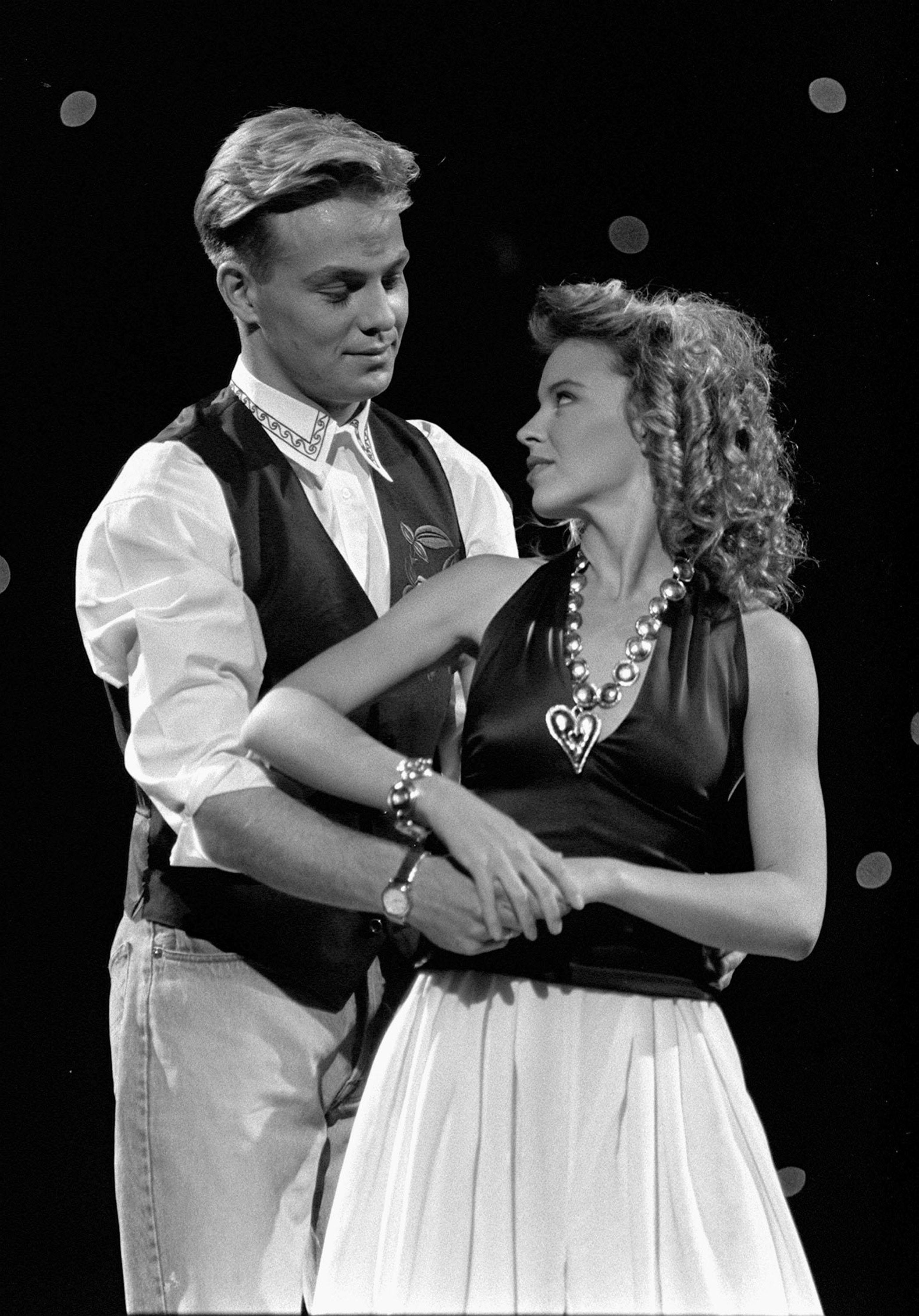 <p>Former Neighbours stars turned pop singers Jason Donovan and Kylie Minogue rehearsing at the Dominion Theatre, London, for the Children’s Royal Variety Performance 1989 (PA)</p>