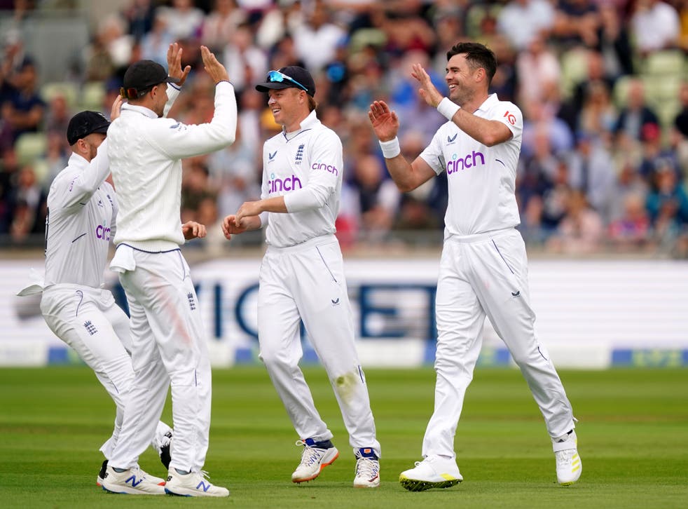 England’s James Anderson (right) celebrates taking the wicket of Cheteshwar Pujara (Mike Egerton/PA)
