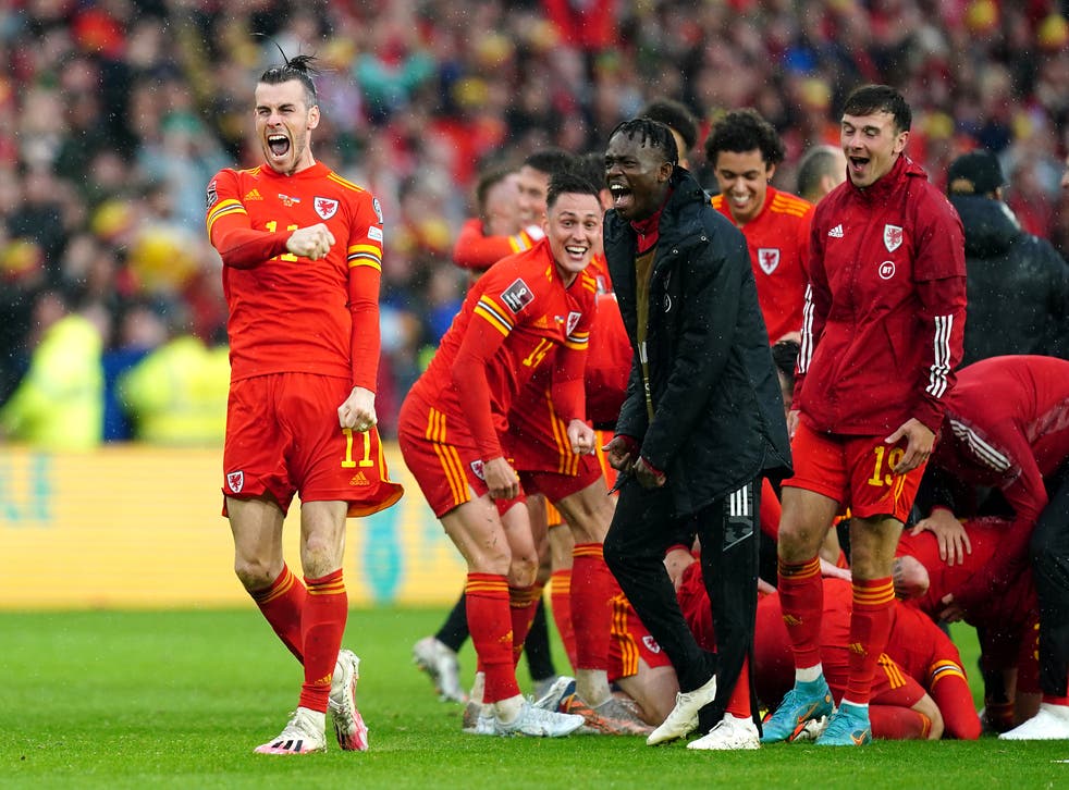 Wales’ Gareth Bale (left) celebrates with team-mates after qualifying for the Qatar World Cup following victory in the FIFA World Cup 2022 Qualifier play-off final match at Cardiff City Stadium, Cardiff (David Davies/PA)