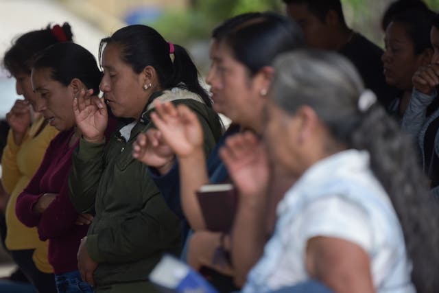 <p>A community prays in the aftermath of the catastrophe in San Antonio.  </p>