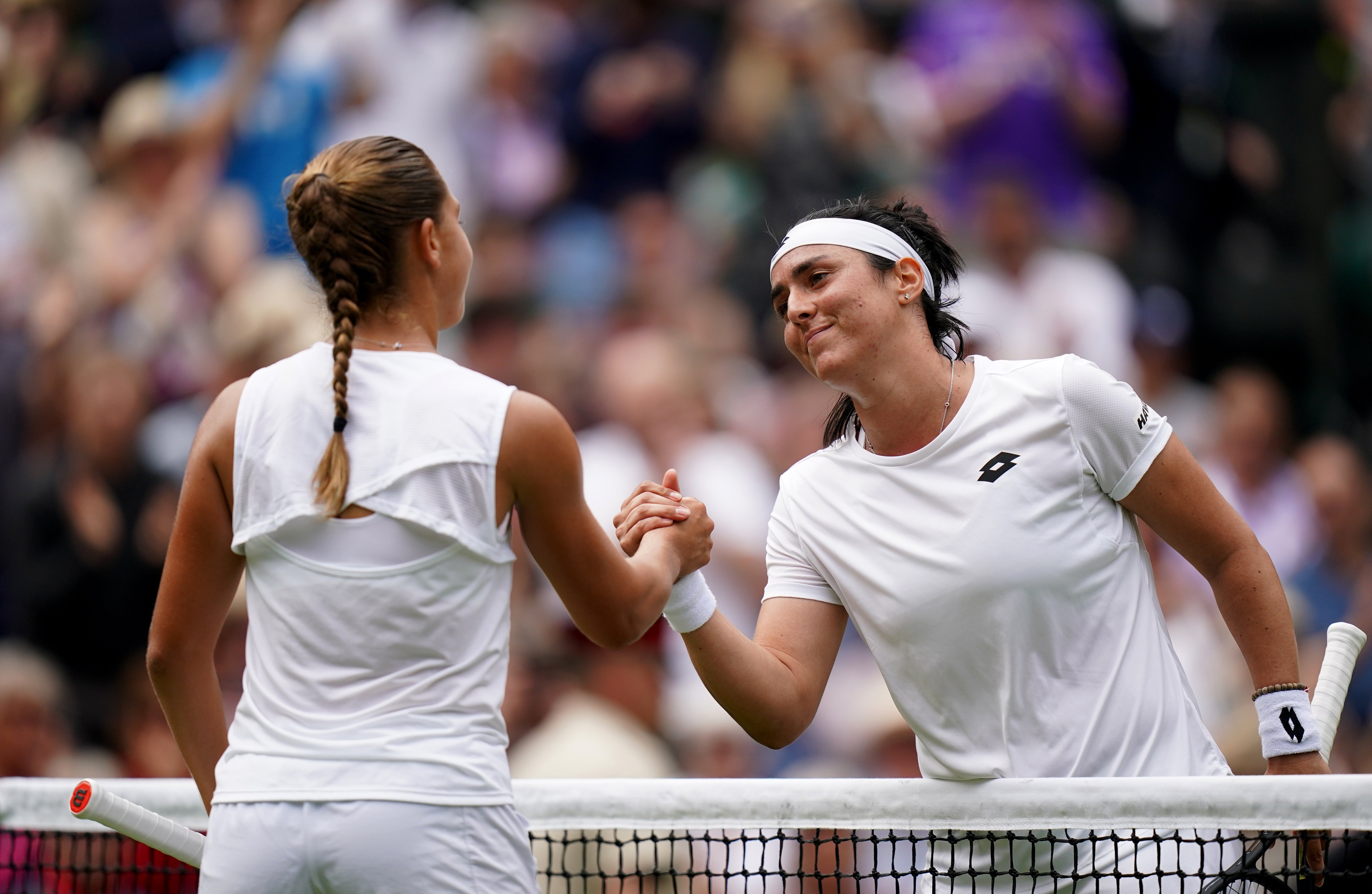 Ons Jabeur shakes hands with Diane Parry (left) after winning in the Wimbledon third round (Adam Davy/PA)